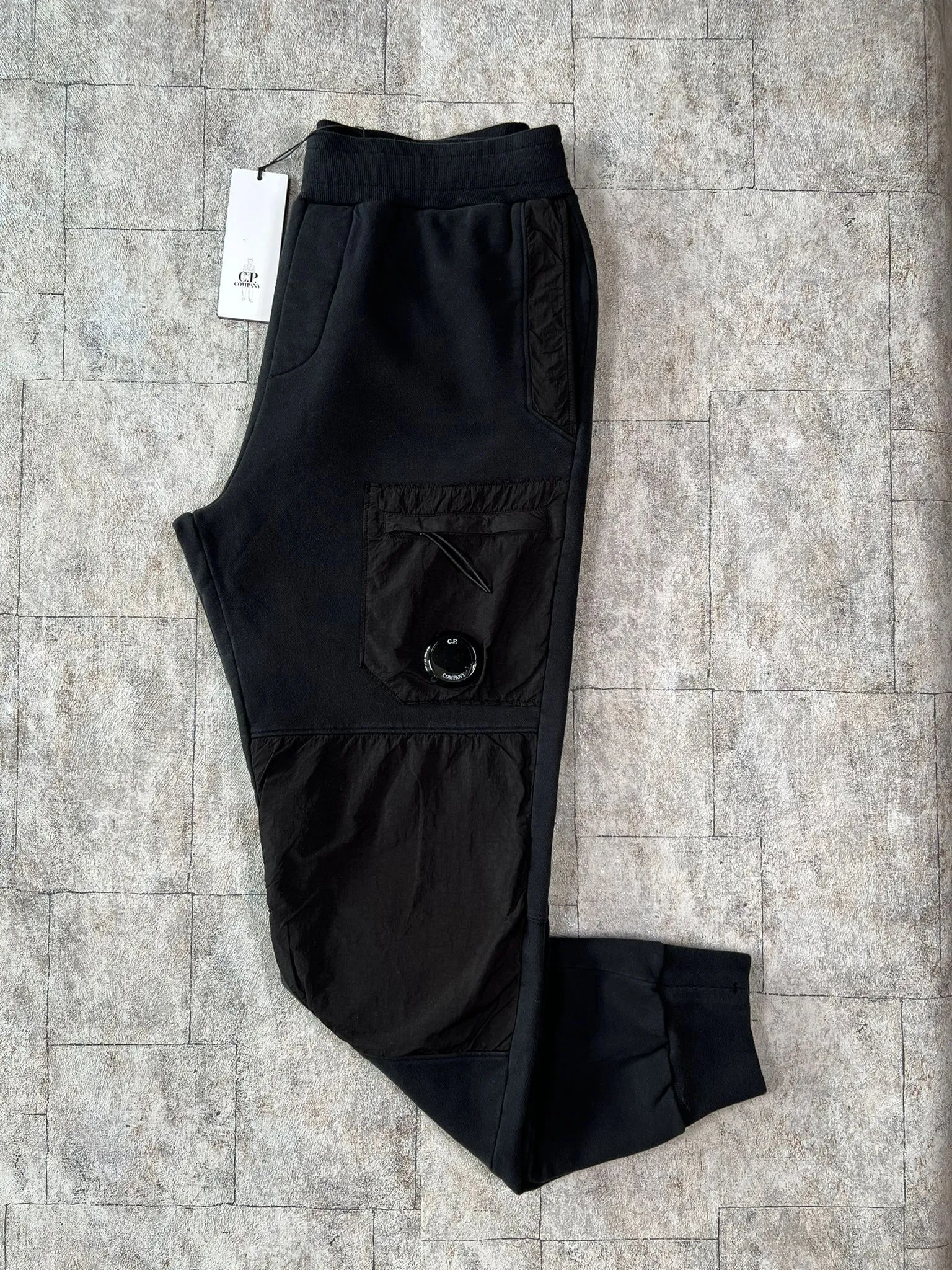 C.P. COMPANY MIX LENS SWEATPANTS