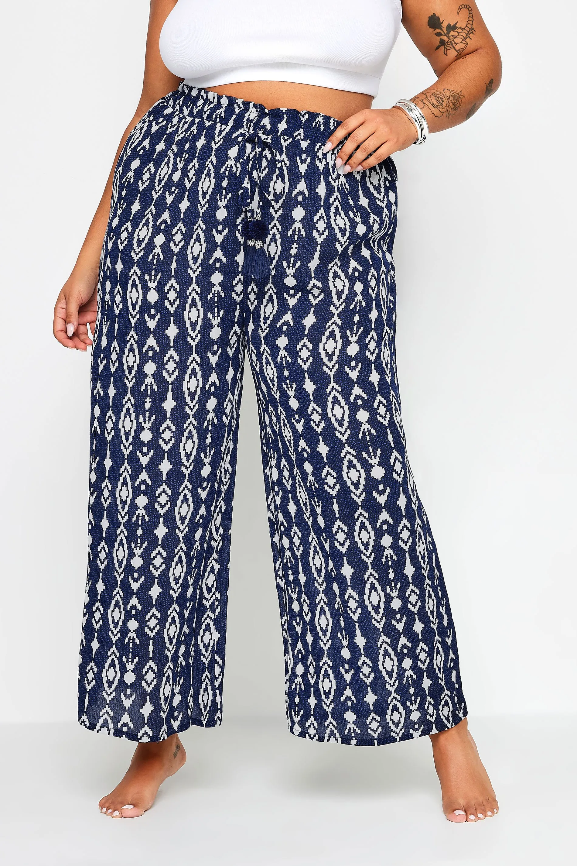 YOURS Curve Navy Blue Ikat Print Crinkle Tassel Trousers